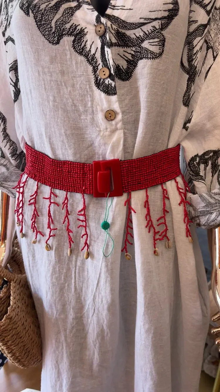 Antica Sartoria elastic belt features red glass seed beads a seashell fringe